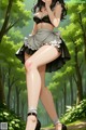 A woman in a maid outfit is walking through the woods.